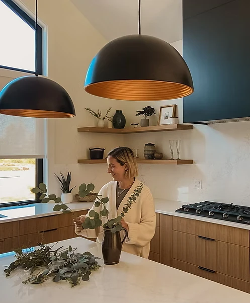 Linzie Linzie standing in one of her kitchens she designed